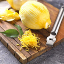 Ralador e zestador de limão em aço inoxidável com faca caneladora para raspas de frutas cítricas e decoração culinária.