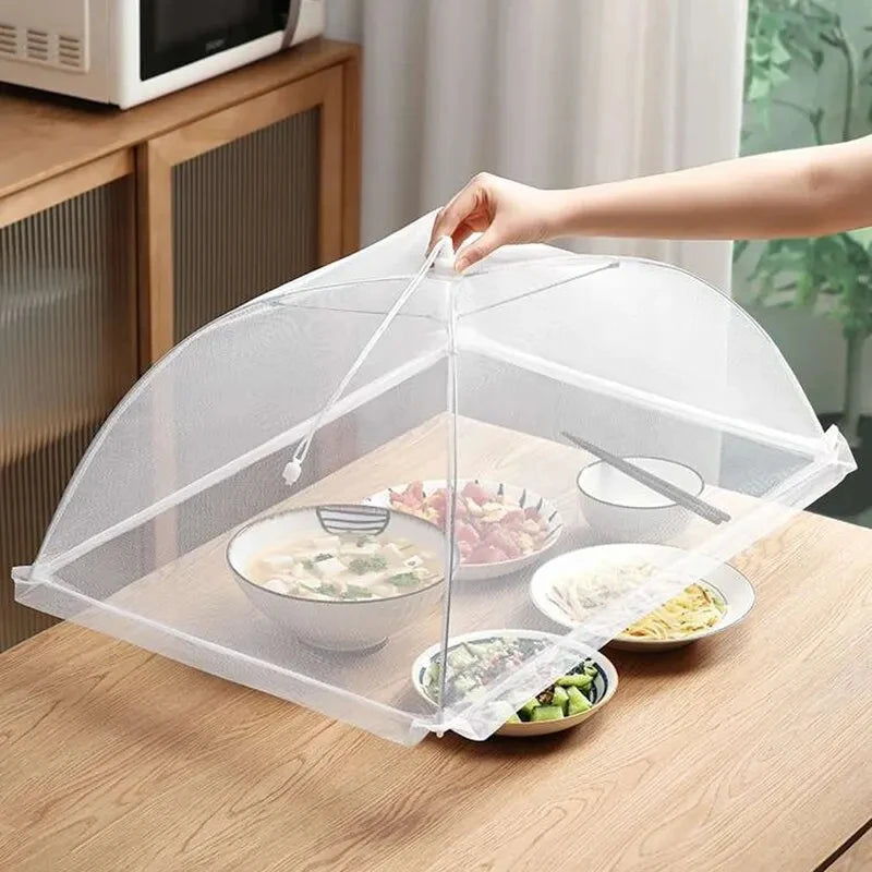 Tela protetora dobrável para alimentos com malha fina, lavável e reutilizável, ideal para proteger pratos, frutas e refeições contra insetos em ambientes internos e externos.