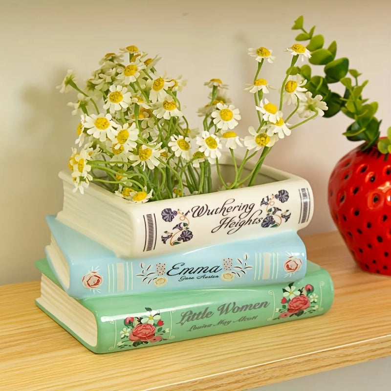 Vaso decorativo em cerâmica com formato de livros empilhados para flores, suculentas e decoração de estantes e salas.